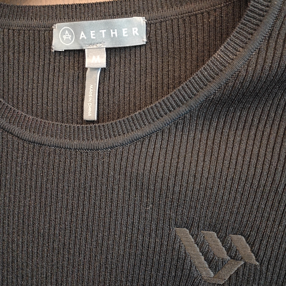 AETHER Women's Black Ribbed Crewneck Top with Subtle Logo